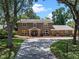 Charming home with a well-manicured lawn, mature trees, and long driveway at 120 Springwood Trl, Altamonte Springs, FL 32714