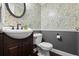 Charming half bathroom with floral wallpaper, pedestal sink, and classic fixtures at 120 Springwood Trl, Altamonte Springs, FL 32714