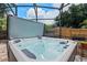 Close-up shot of a hot tub situated on a patio with a screen enclosure at 120 Springwood Trl, Altamonte Springs, FL 32714