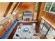 Bright living room featuring a stone fireplace and wood paneled walls and ceiling at 120 Springwood Trl, Altamonte Springs, FL 32714