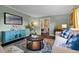 Cozy living room with light green walls, colorful rug, and modern decor at 120 Springwood Trl, Altamonte Springs, FL 32714