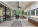 Inviting outdoor patio with tile floors, ceiling fan, and an outdoor lounge area at 120 Springwood Trl, Altamonte Springs, FL 32714