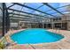 Enjoy the large in-ground screened-in pool with a stone surround, alongside a jacuzzi at 120 Springwood Trl, Altamonte Springs, FL 32714