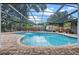 Sparkling screened-in pool and patio with lush landscaping at 120 Springwood Trl, Altamonte Springs, FL 32714
