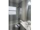 This bathroom features modern tiles, shower, and lighting at 1241 Cleveland Ave, Apopka, FL 32703