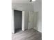 This bedroom features wood floors, ceiling fan, closet, and ensuite bathroom at 1241 Cleveland Ave, Apopka, FL 32703
