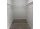 This walk-in closet has wood floors and plenty of storage at 1241 Cleveland Ave, Apopka, FL 32703