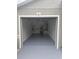 A well-lit garage featuring a sealed floor and ample storage space at 1241 Cleveland Ave, Apopka, FL 32703