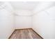 This closet features wood-look flooring and wired shelving units at 1242 Liza St, St Cloud, FL 34771