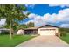Charming single-story home with a spacious front yard and screened patio at 1242 Liza St, St Cloud, FL 34771