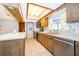 Cozy kitchen featuring wooden cabinetry and modern stainless steel appliances at 1242 Liza St, St Cloud, FL 34771