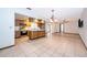 Open kitchen and living room with tile flooring, stainless appliances at 1242 Liza St, St Cloud, FL 34771