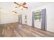 Bright living room with hardwood flooring and natural light from large windows at 1242 Liza St, St Cloud, FL 34771