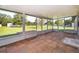 Enclosed patio with tile flooring and views to the expansive yard at 1242 Liza St, St Cloud, FL 34771