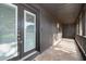 Enclosed porch featuring access door and large screened window at 1242 Liza St, St Cloud, FL 34771