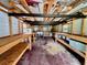 Bright workshop interior with extensive built-in shelving, offering ample storage and workspace at 1242 Liza St, St Cloud, FL 34771