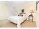 Bright bedroom with natural light, comfortable bed, and serene decor, creating a cozy and inviting space for relaxation at 1355 Hibiscus Ave, Winter Park, FL 32789