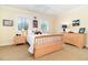 Inviting bedroom with natural light, neutral palette, and simple decor, creating a peaceful retreat. Go Tigers! at 1355 Hibiscus Ave, Winter Park, FL 32789