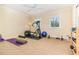Home gym with a variety of fitness equipment, including a treadmill, weights, and yoga mat, promoting a healthy lifestyle at 1355 Hibiscus Ave, Winter Park, FL 32789