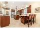 Spacious kitchen features stainless steel appliances, dark wood cabinetry and a large center island at 1355 Hibiscus Ave, Winter Park, FL 32789