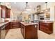 Open-concept kitchen with granite counters, stainless appliances, and central island sink at 1355 Hibiscus Ave, Winter Park, FL 32789