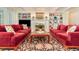Bright living room with a fireplace, custom bookshelves, and comfortable seating at 1355 Hibiscus Ave, Winter Park, FL 32789