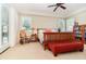 Bright main bedroom with natural light, neutral carpet, and comfortable furnishings at 1355 Hibiscus Ave, Winter Park, FL 32789
