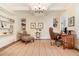 Cozy office with custom built-in bookshelves and a comfortable seating area at 1355 Hibiscus Ave, Winter Park, FL 32789