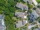 Aerial view of a beautiful home with a lush green yard and mature trees at 1438 Stickley Ave, Celebration, FL 34747