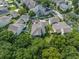 Overhead shot of the home with a backyard patio and mature shade trees at 1438 Stickley Ave, Celebration, FL 34747