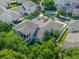 An aerial view showcases the house with a screened lanai and outdoor seating at 1438 Stickley Ave, Celebration, FL 34747