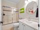Bathroom with a glass shower door, a toilet, and a single vanity sink at 1438 Stickley Ave, Celebration, FL 34747