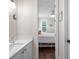 Bathroom with a single vanity sink and marble countertops leading into a bedroom at 1438 Stickley Ave, Celebration, FL 34747
