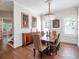 Elegant dining room featuring hardwood floors, a crystal chandelier, wainscoting, and natural light at 1438 Stickley Ave, Celebration, FL 34747
