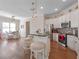 Bright kitchen with stainless steel appliances, granite countertops, and island seating at 1438 Stickley Ave, Celebration, FL 34747