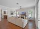 Bright living room with hardwood floors, plantation shutters, and a comfortable seating area at 1438 Stickley Ave, Celebration, FL 34747