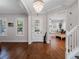 Bright living room featuring hardwood floors, plantation shutters, and an open floor plan at 1438 Stickley Ave, Celebration, FL 34747