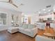 Open-concept living space with hardwood floors and kitchen island perfect for entertaining at 1438 Stickley Ave, Celebration, FL 34747