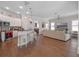 Open floor plan with kitchen island, stainless appliances, and connected living space at 1438 Stickley Ave, Celebration, FL 34747