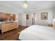 Spacious bedroom with hardwood floors, television, and a view of the outdoors at 1438 Stickley Ave, Celebration, FL 34747
