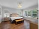 Serene primary bedroom with hardwood floors, ample natural light, and stylish decor at 1438 Stickley Ave, Celebration, FL 34747