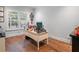 Bright office space featuring hardwood floors, a large window with plantation shutters and neutral paint at 1438 Stickley Ave, Celebration, FL 34747