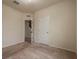 Neutral bedroom with carpet and view to stairs through open door at 14390 Orchid Island Dr, Orlando, FL 32827