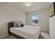 Comfortable bedroom featuring a soft bed, cozy pillows, and a window view at 14390 Orchid Island Dr, Orlando, FL 32827