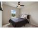 Comfortable bedroom with a ceiling fan and a large window offering natural light at 14390 Orchid Island Dr, Orlando, FL 32827