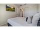 Relaxing bedroom with TV, closet and comfortable bed at 14390 Orchid Island Dr, Orlando, FL 32827