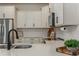 Well-appointed kitchen features modern fixtures and stainless steel appliances at 14390 Orchid Island Dr, Orlando, FL 32827
