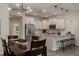 Bright, open kitchen with stainless steel appliances, white cabinets, pendant lights, and dining area nearby at 14390 Orchid Island Dr, Orlando, FL 32827