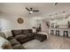 Open-concept living space with seating, dining area, and kitchen, creating an inviting atmosphere at 14390 Orchid Island Dr, Orlando, FL 32827