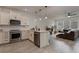 Modern kitchen showcasing stainless steel appliances and view of the living room at 14390 Orchid Island Dr, Orlando, FL 32827